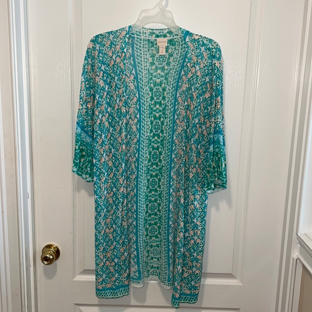 Chico’s light weight duster sweater. Hits at the knee. Size 1. Beautiful design.